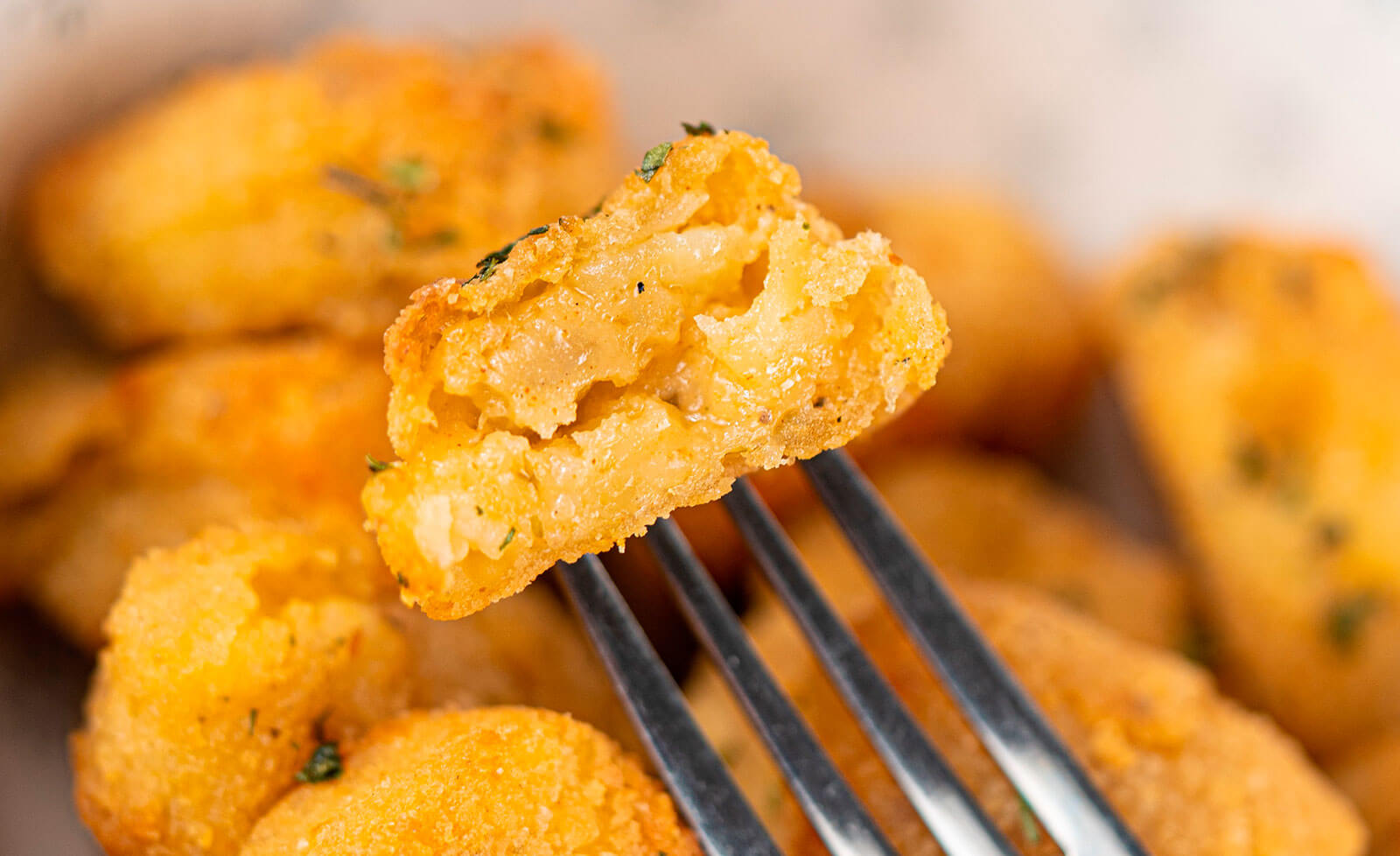 Croquetas de papa estilo tex-mex - Caja de 5 kg – Flow pack de 500 gr.